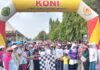 Bupati Luwu Utara Lepas Ribuan Peserta Jalan Santai HUT IBI ke-75
